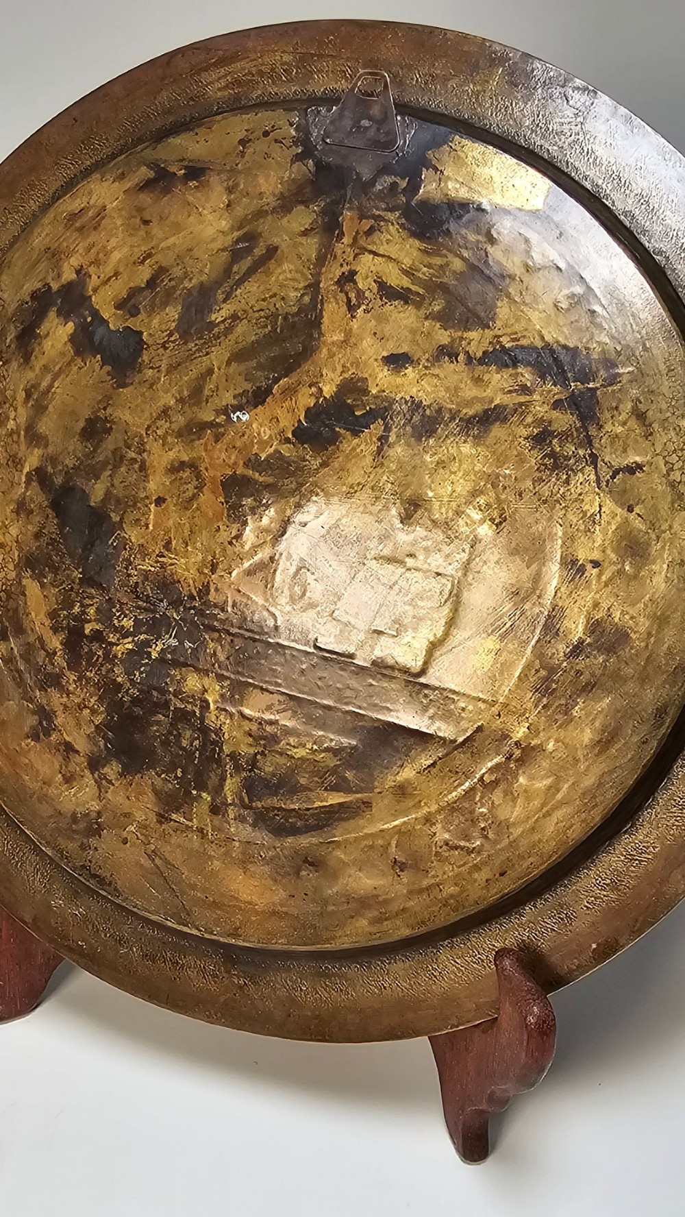 A circular brass charger featuring mixed silver and copper inlay artwork depicting Egyptian figures, cartouches, lotus flower borders, and winged sun disc motifs. View XV