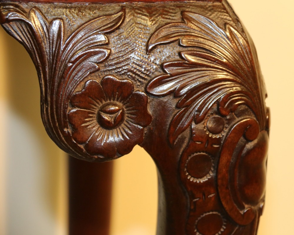 An 18th-century mahogany fold-out card table with a green baize inset top, corner candle stands, and carved cabriole legs ending in claw and ball feet. View VII