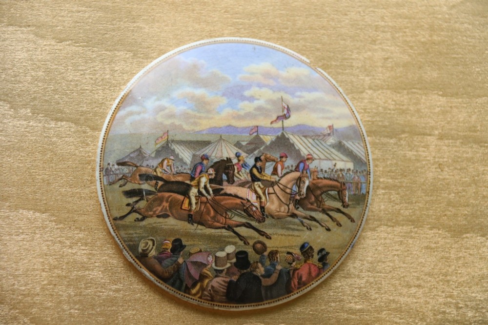 A large rectangular ornate gilt frame displaying thirty-five circular Victorian polychrome transfer-printed ceramic pot lids mounted in grid formation. View VIII