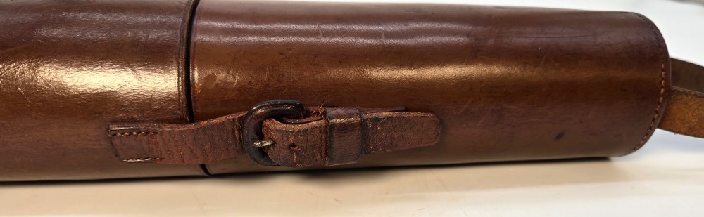 A brass multi-draw military telescope featuring stitched brown leather protective sleeves along the barrel. View XIV