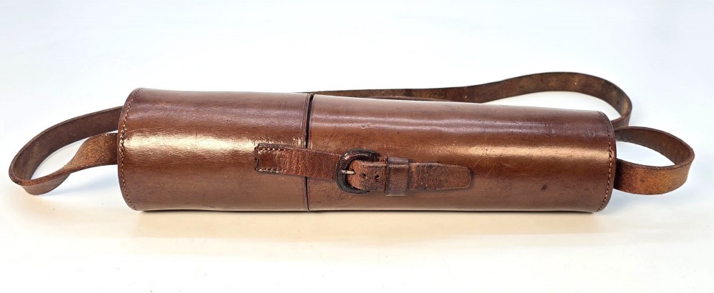 A brass multi-draw military telescope featuring stitched brown leather protective sleeves along the barrel. View XV