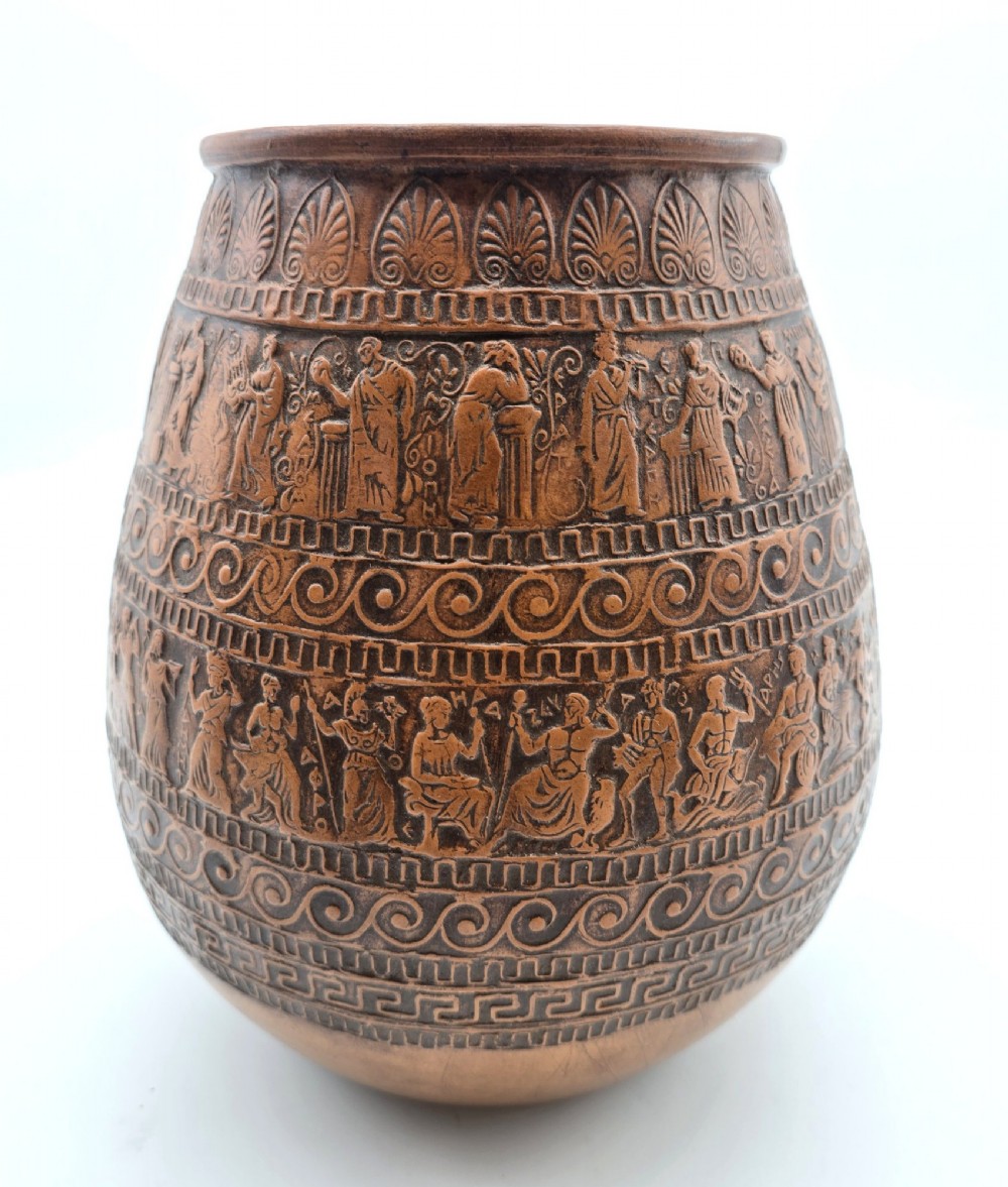 A round terracotta vase decorated with bands of relief-carved Greek classical figures, scrollwork, and geometric meander patterns. View II
