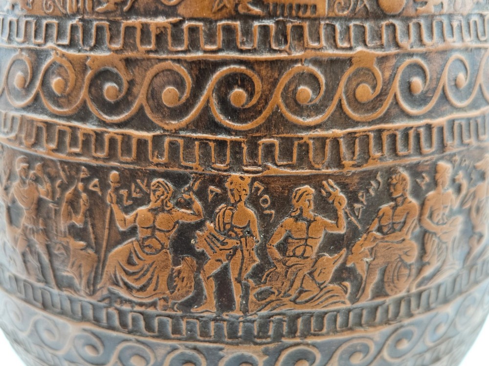 A round terracotta vase decorated with bands of relief-carved Greek classical figures, scrollwork, and geometric meander patterns. View VIII