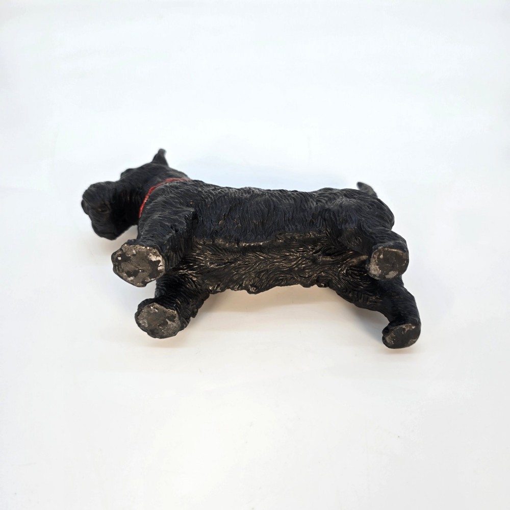 A hand-painted black cast metal table lighter shaped as a standing Scottish Terrier dog with a red collar. View XIV