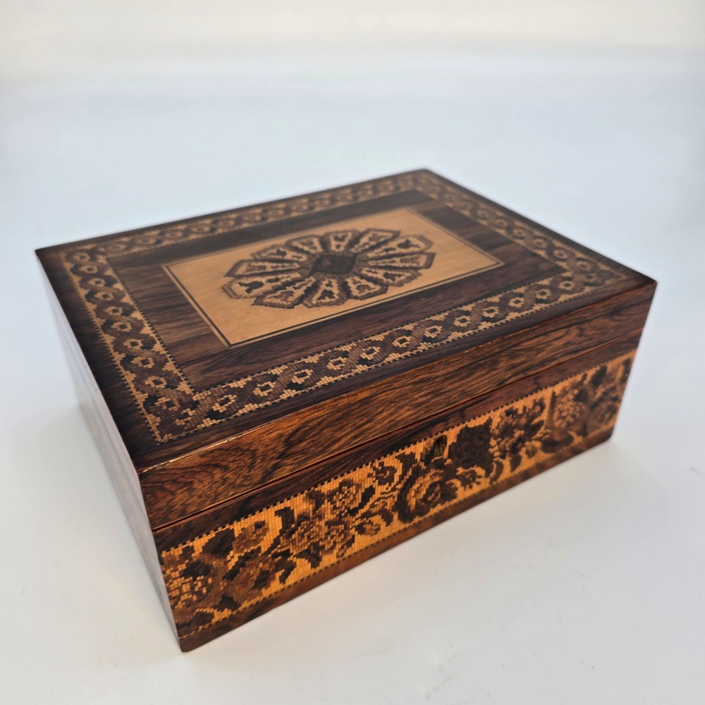 Rectangular dark rosewood jewellery box decorated with Tunbridge Ware micro-marquetry geometric patterns and a floral mosaic band around the base.
