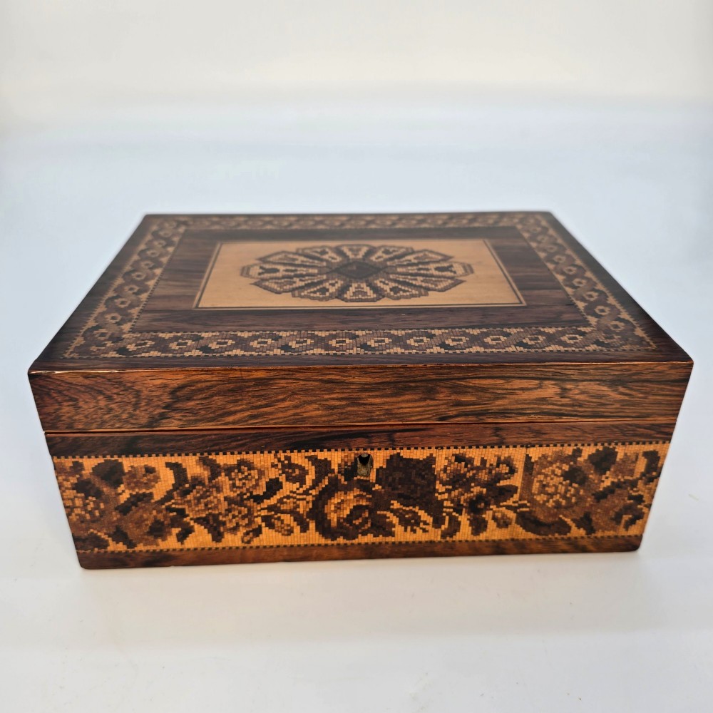 Rectangular dark rosewood jewellery box decorated with Tunbridge Ware micro-marquetry geometric patterns and a floral mosaic band around the base. View II