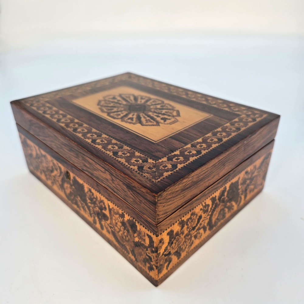 Rectangular dark rosewood jewellery box decorated with Tunbridge Ware micro-marquetry geometric patterns and a floral mosaic band around the base. View III
