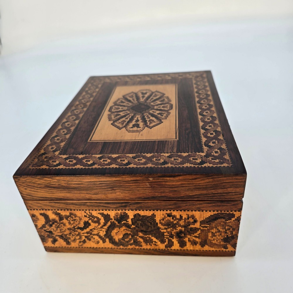 Rectangular dark rosewood jewellery box decorated with Tunbridge Ware micro-marquetry geometric patterns and a floral mosaic band around the base. View IV
