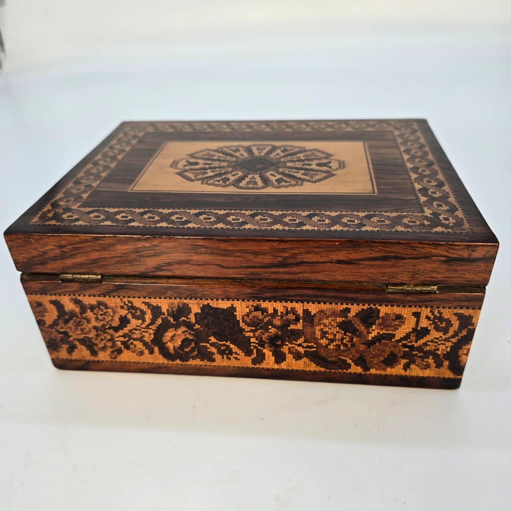 Rectangular dark rosewood jewellery box decorated with Tunbridge Ware micro-marquetry geometric patterns and a floral mosaic band around the base. View V
