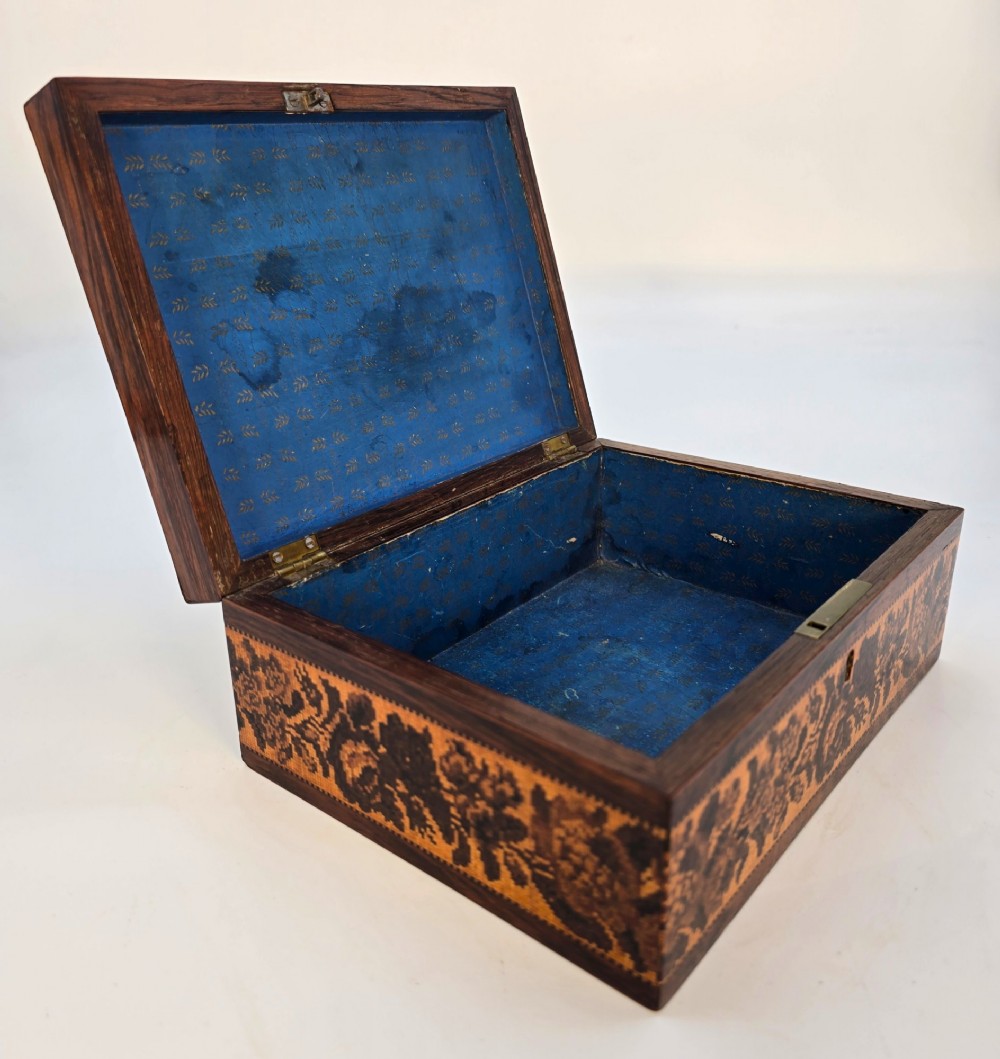 Rectangular dark rosewood jewellery box decorated with Tunbridge Ware micro-marquetry geometric patterns and a floral mosaic band around the base. View VI