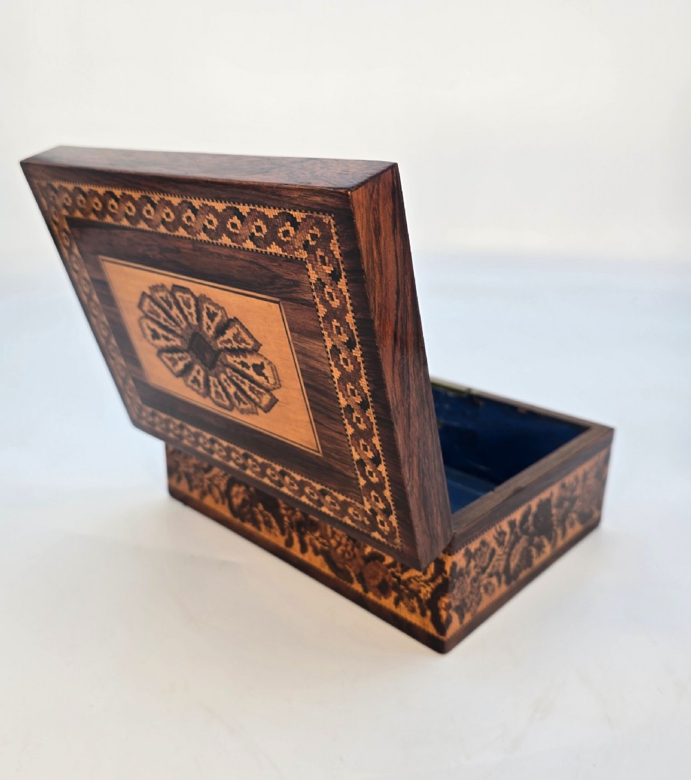 Rectangular dark rosewood jewellery box decorated with Tunbridge Ware micro-marquetry geometric patterns and a floral mosaic band around the base. View X
