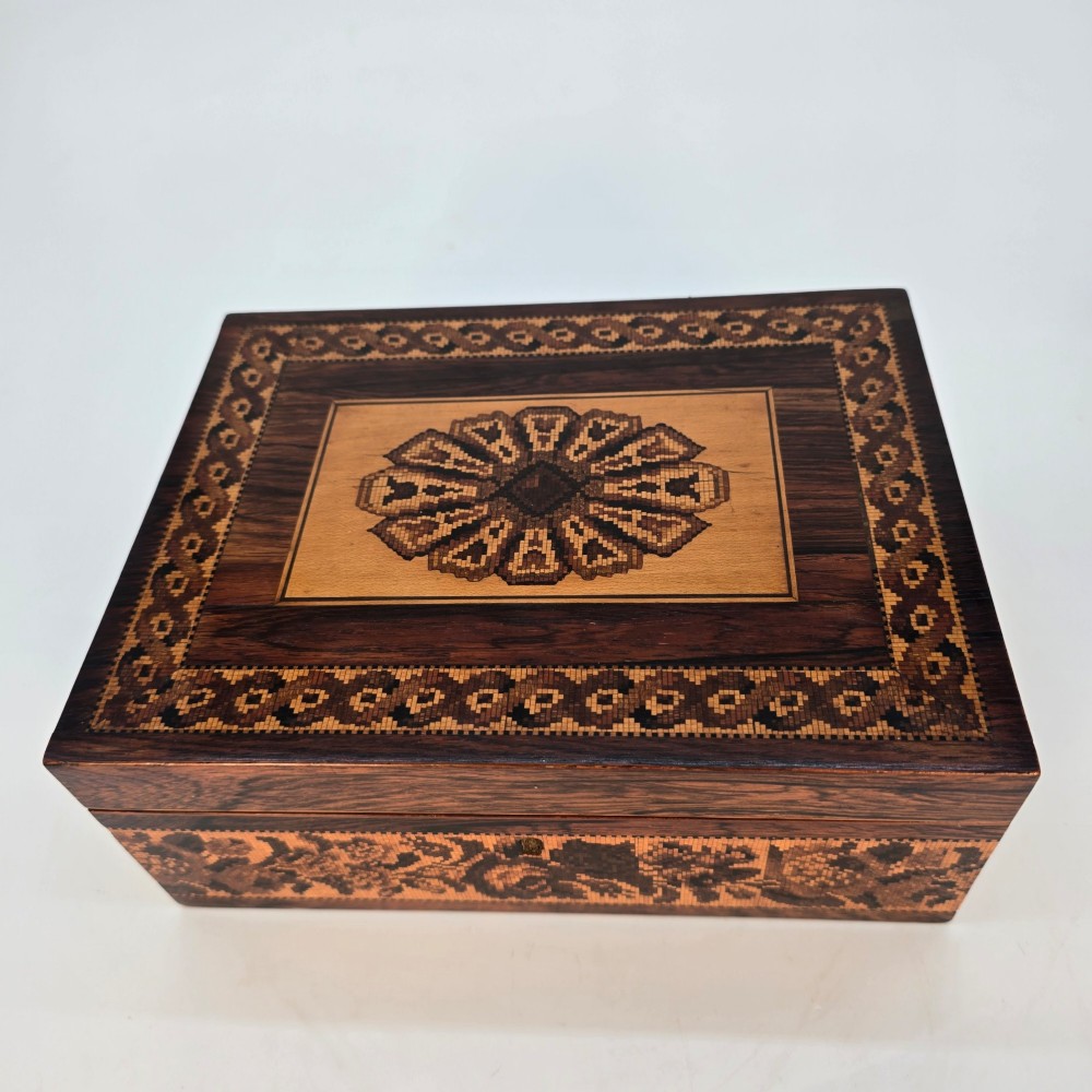 Rectangular dark rosewood jewellery box decorated with Tunbridge Ware micro-marquetry geometric patterns and a floral mosaic band around the base. View XI