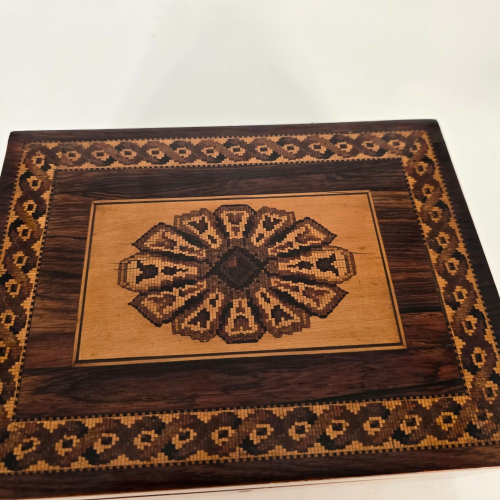 Rectangular dark rosewood jewellery box decorated with Tunbridge Ware micro-marquetry geometric patterns and a floral mosaic band around the base. View XIV