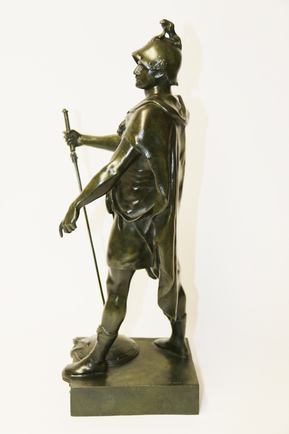 A late 19th-century patinated dark bronze sculpture depicting a Roman warrior with a sword resting against a shield on a rectangular base. View II