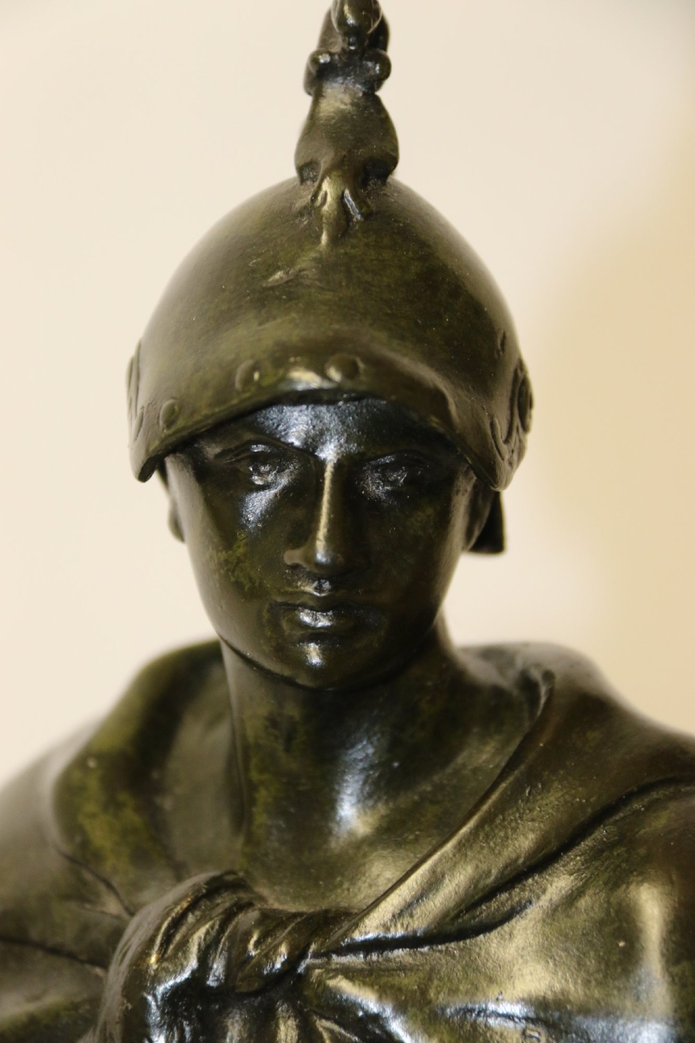 A late 19th-century patinated dark bronze sculpture depicting a Roman warrior with a sword resting against a shield on a rectangular base. View III
