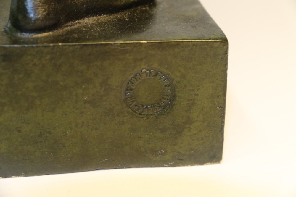 A late 19th-century patinated dark bronze sculpture depicting a Roman warrior with a sword resting against a shield on a rectangular base. View VII