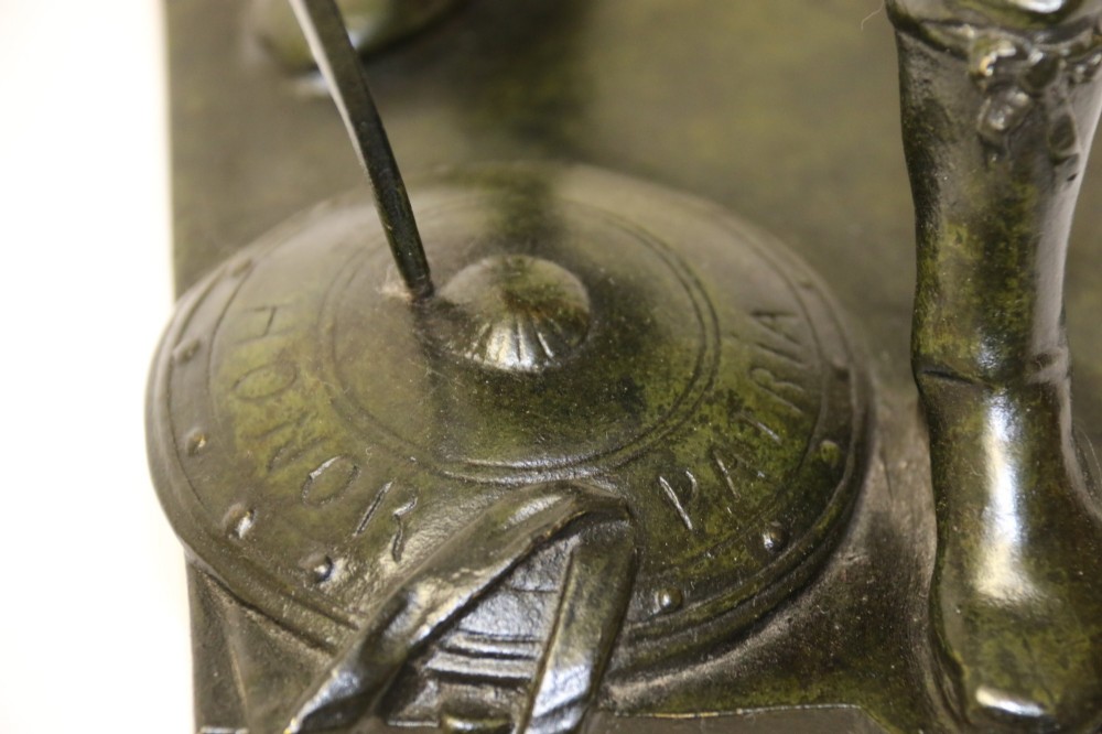 A late 19th-century patinated dark bronze sculpture depicting a Roman warrior with a sword resting against a shield on a rectangular base. View XV