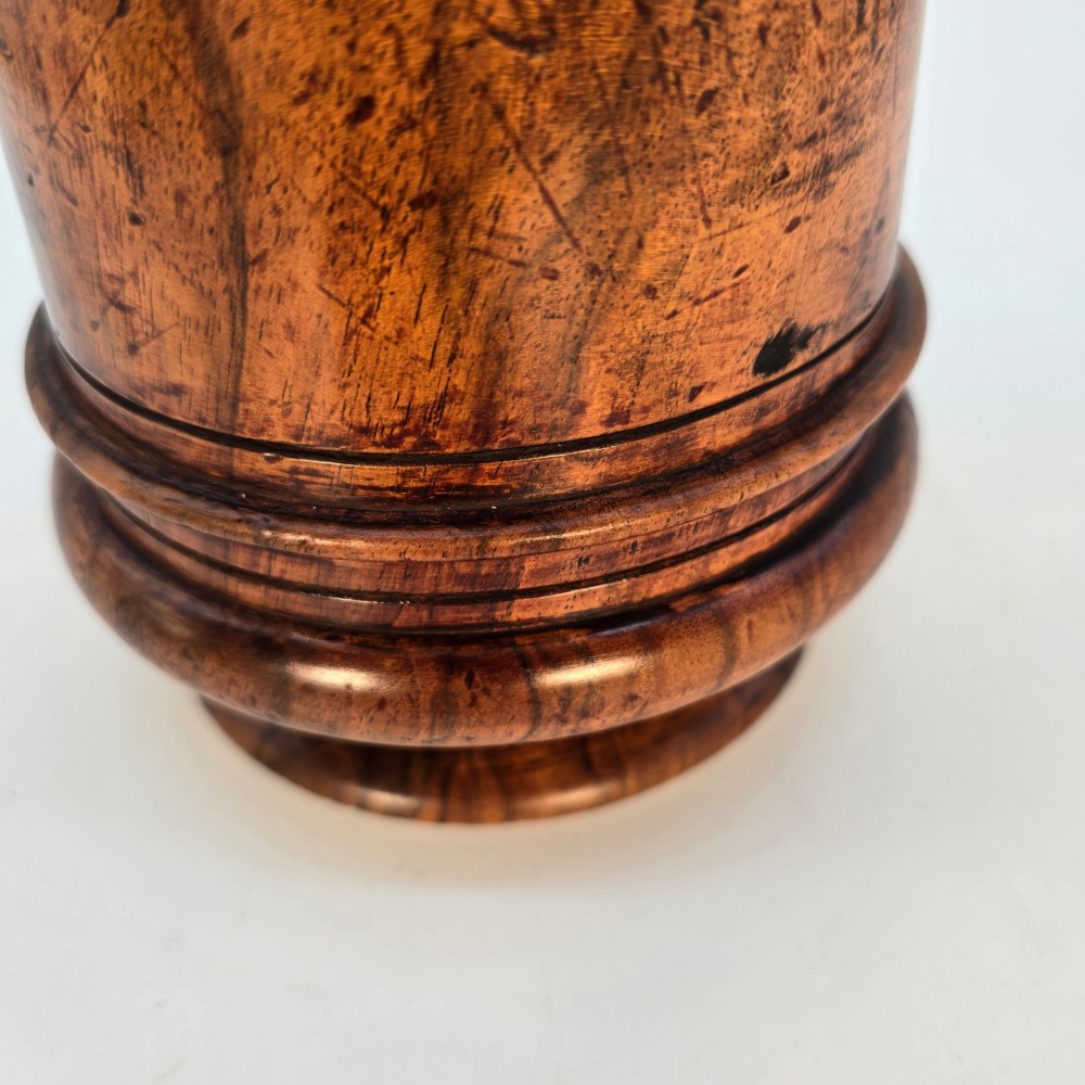 An 18th-century turned walnut wooden tobacco jar featuring a knopped finial lid, turned mouldings, and a dark aged grain surface. View XII