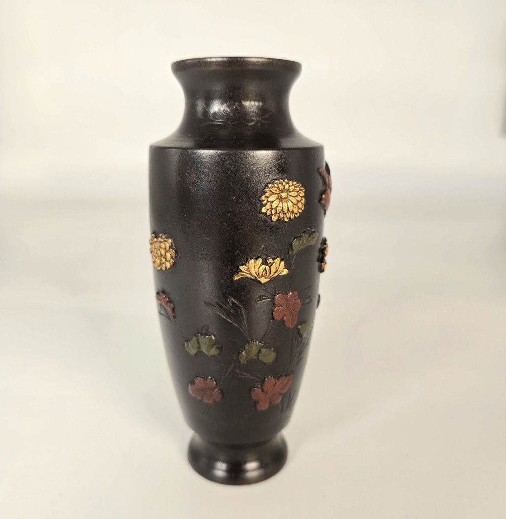 A dark brown patinated bronze Japanese vase featuring raised relief inlays of gold and copper chrysanthemums alongside a bird in flight. View III