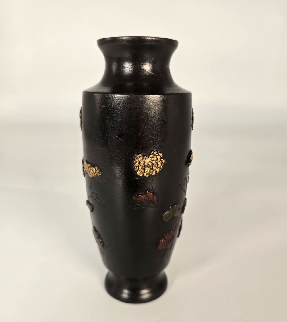 A dark brown patinated bronze Japanese vase featuring raised relief inlays of gold and copper chrysanthemums alongside a bird in flight. View IV
