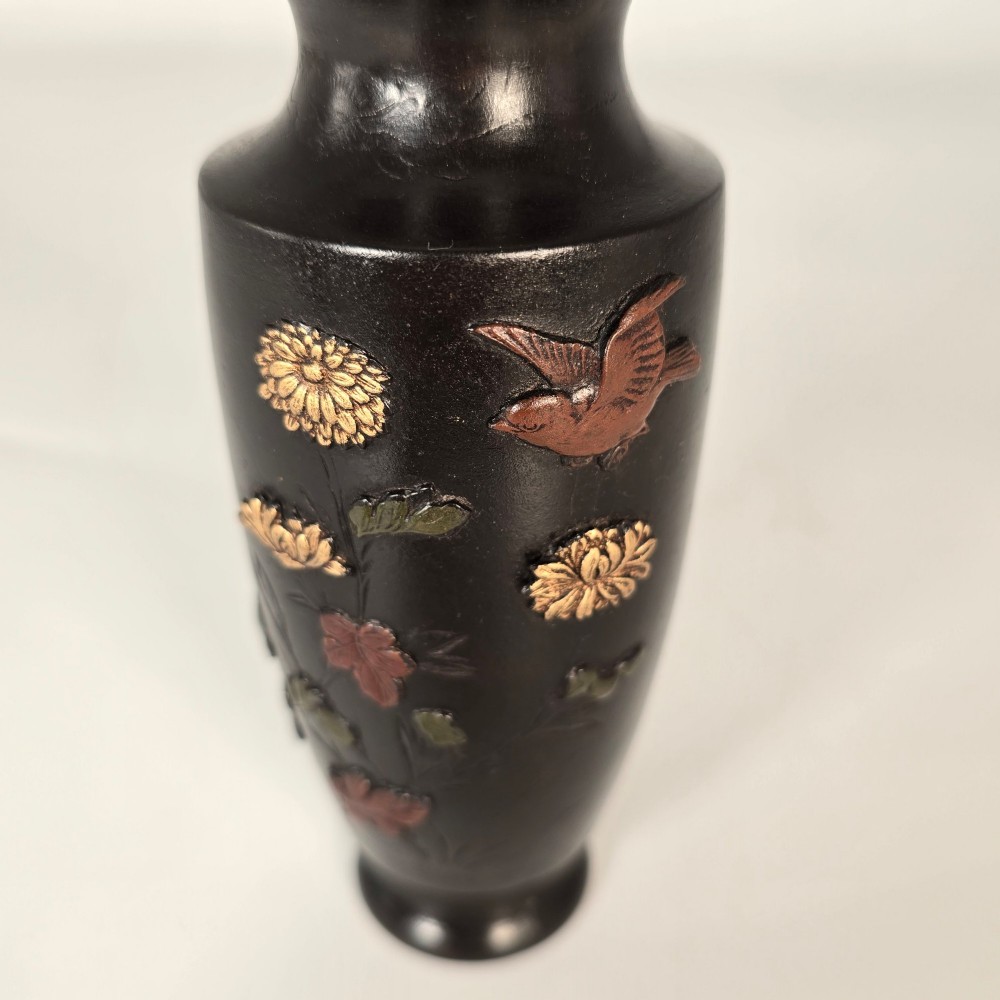 A dark brown patinated bronze Japanese vase featuring raised relief inlays of gold and copper chrysanthemums alongside a bird in flight. View XI