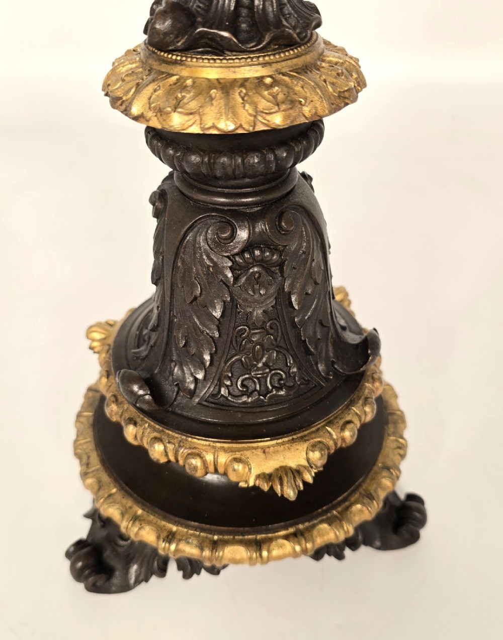 A pair of 19th-century French dark patinated bronze five-light candelabra with gilt bronze accents and sculptural figures. View VIII