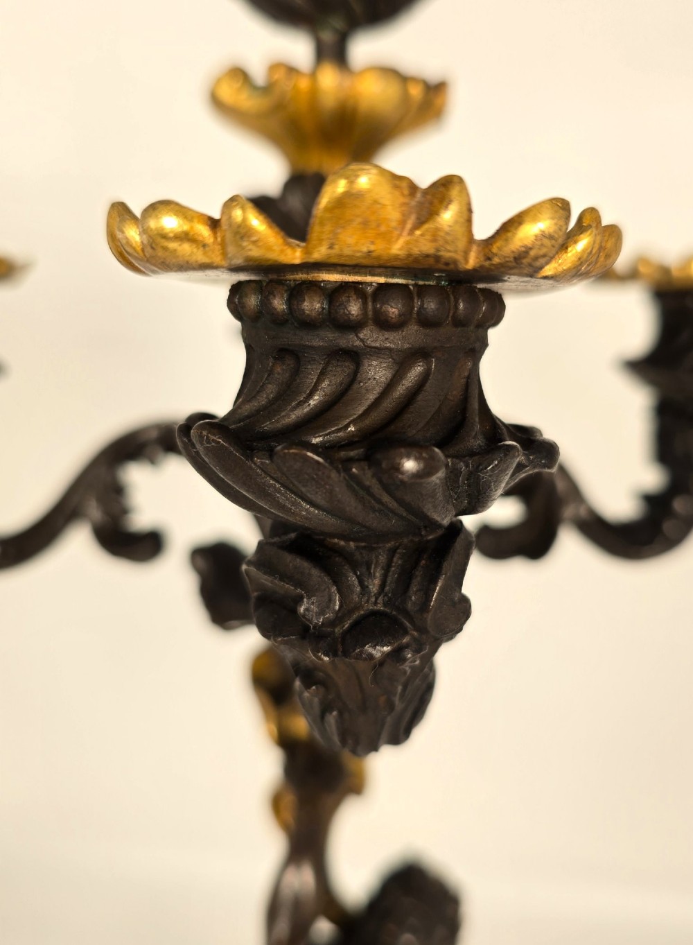 A pair of 19th-century French dark patinated bronze five-light candelabra with gilt bronze accents and sculptural figures. View XI