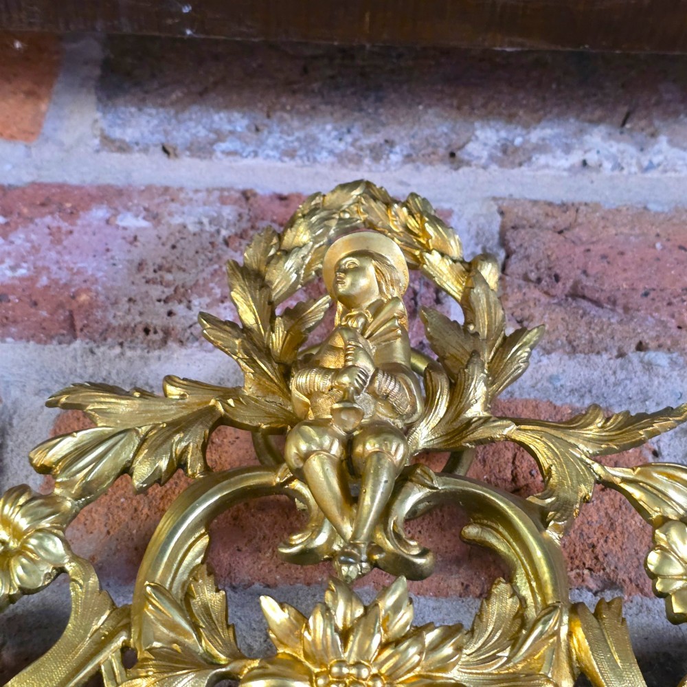 A 19th-century French ormolu girandole wall mirror featuring an ornate foliage frame, central oval mirror, and six branching candle arms. View III