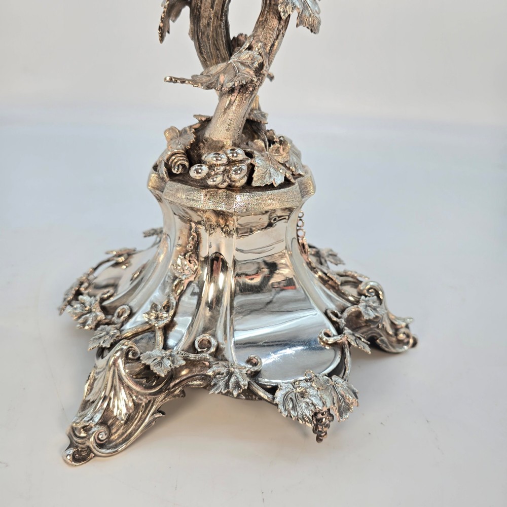 A Victorian silver-plated table centrepiece featuring an intertwined grapevine stem supporting a cut glass bowl. View V