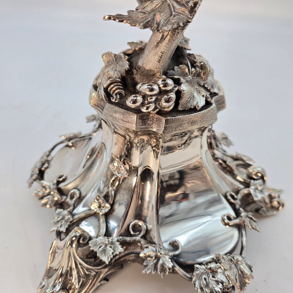 A Victorian silver-plated table centrepiece featuring an intertwined grapevine stem supporting a cut glass bowl. View VI