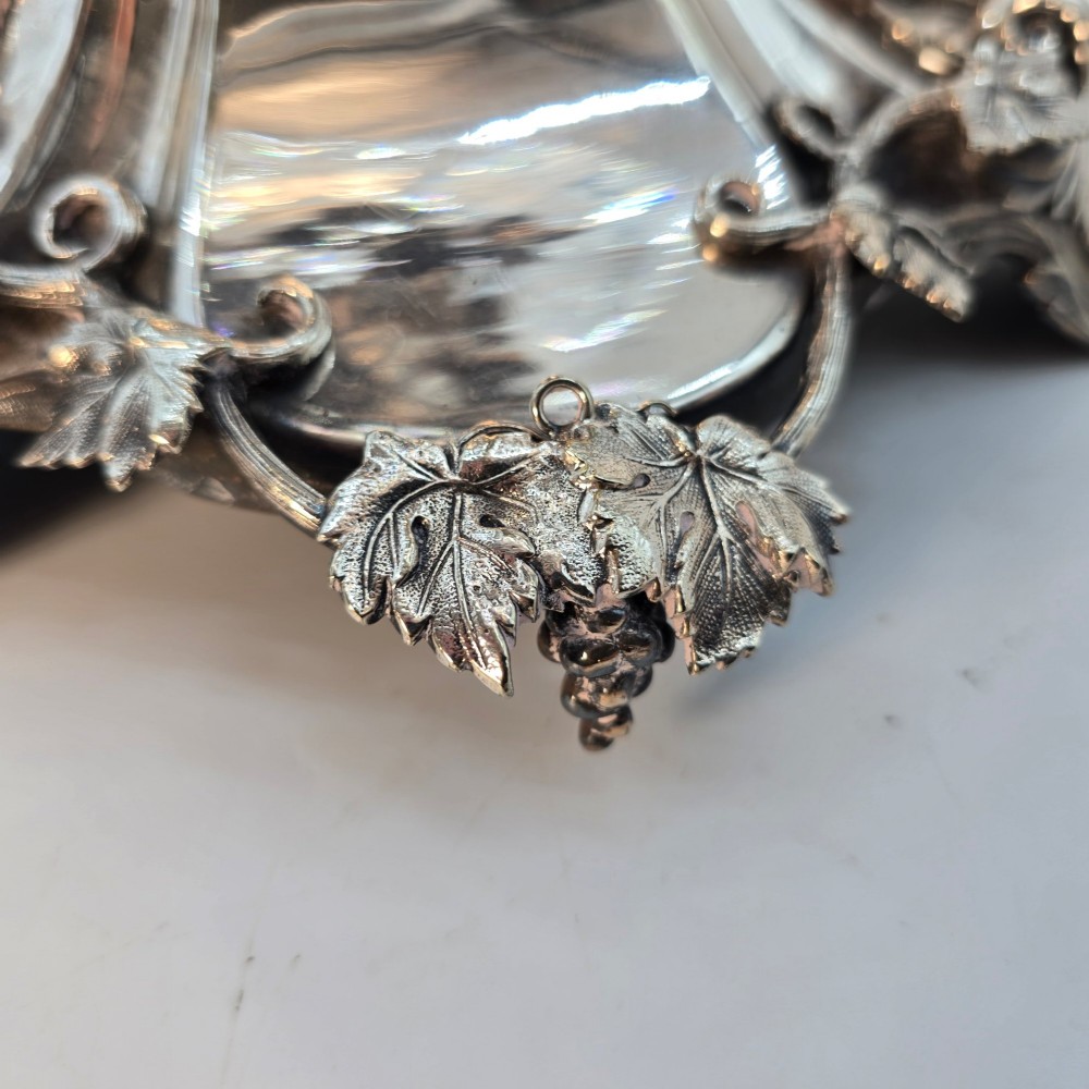 A Victorian silver-plated table centrepiece featuring an intertwined grapevine stem supporting a cut glass bowl. View X