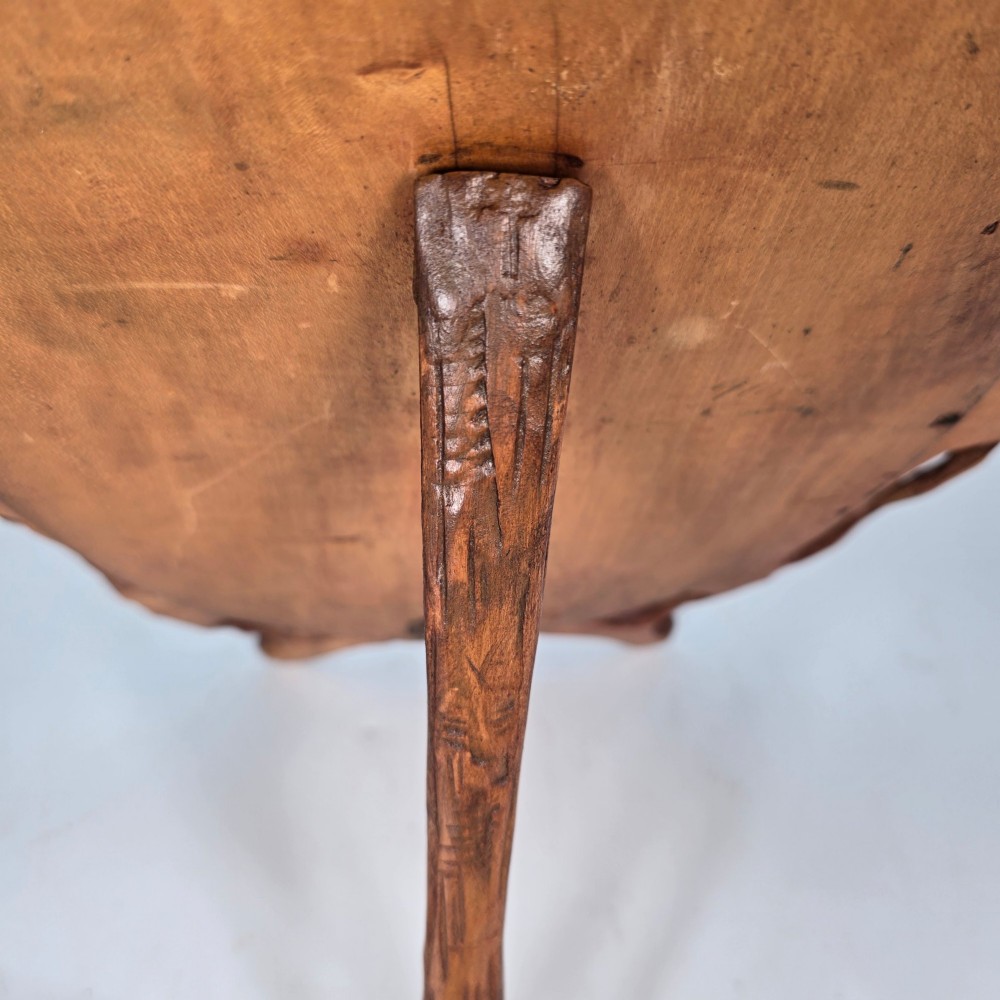 A late nineteenth-century Swiss carved lime wood oval table mirror surrounded by relief carvings of grapevine leaves and grapes. View VII