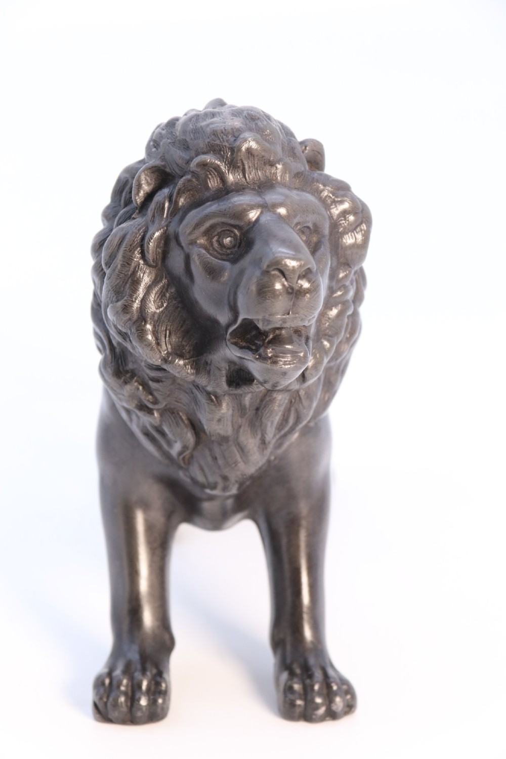 A dark patinated pewter sculpture depicting a standing male lion with a flowing mane and open mouth. View II