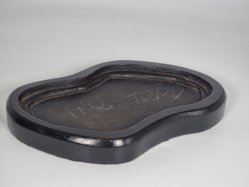 A hand-sculpted warm brown pottery pair of owls featuring textured feather detailing resting on an oval ebonised wooden base. View XIII