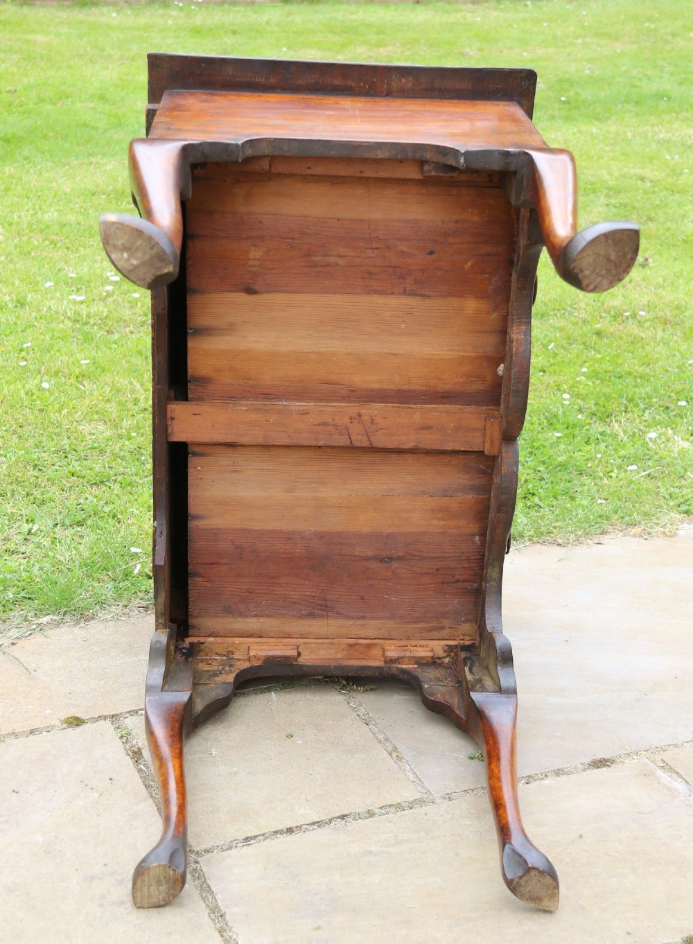 A George II burr elm lowboy table with three drawers, brass handles, a shaped apron, and cabriole legs. View XIII