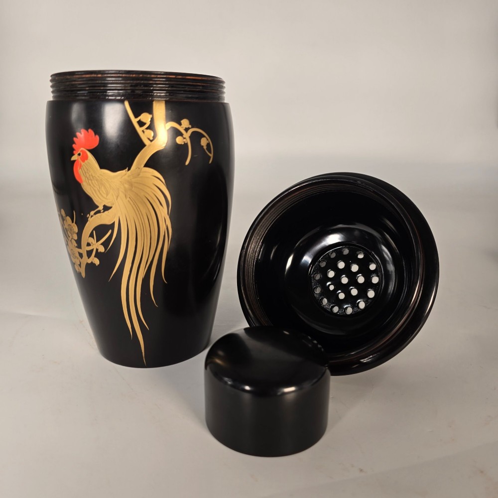 A black and gold hand-painted Japanese lacquer cocktail set comprising a shaker, six stemmed glasses, and a rectangular tray adorned with rooster motifs. View VI