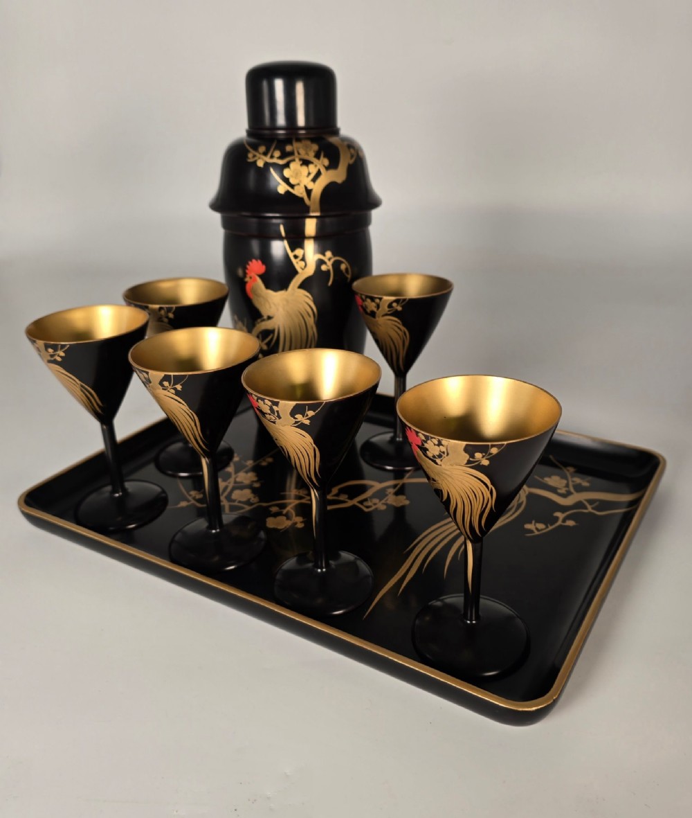 A black and gold hand-painted Japanese lacquer cocktail set comprising a shaker, six stemmed glasses, and a rectangular tray adorned with rooster motifs. View XIII