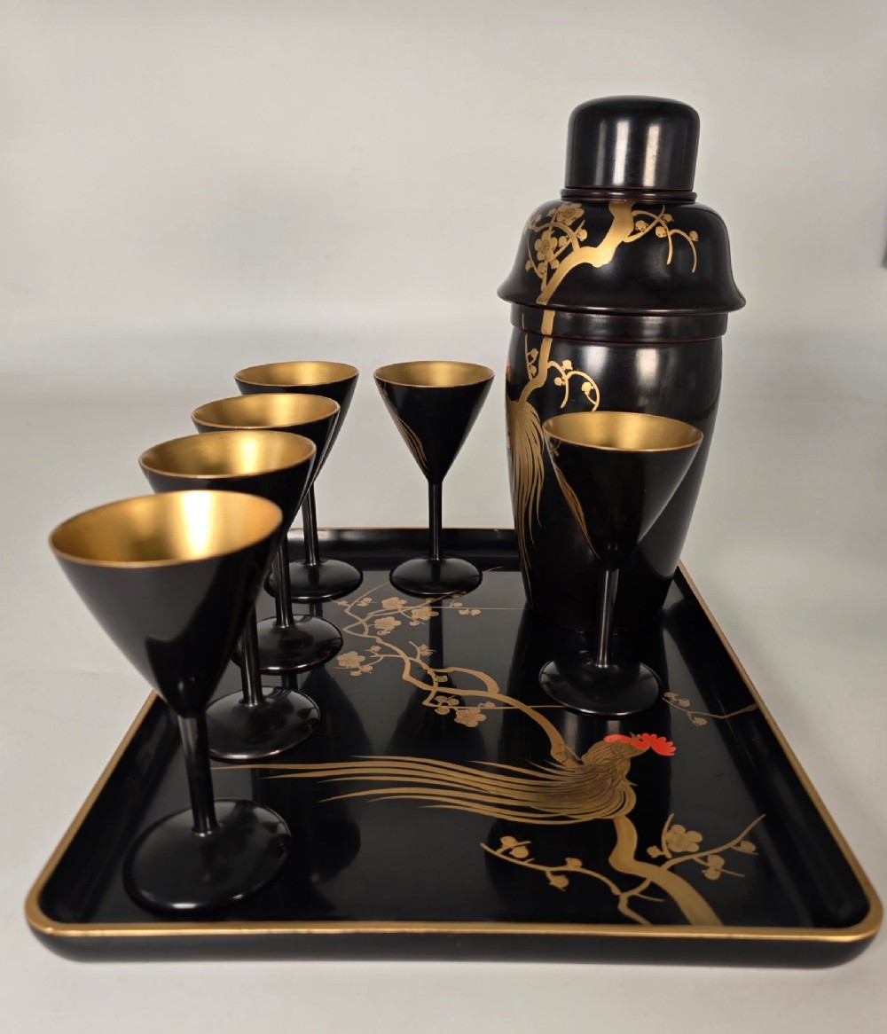 A black and gold hand-painted Japanese lacquer cocktail set comprising a shaker, six stemmed glasses, and a rectangular tray adorned with rooster motifs. View XIV