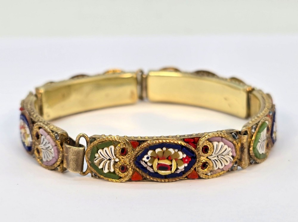 An antique gilt metal link bracelet featuring micro mosaic glass panels, including a central oval panel displaying the word Venezia in white lettering against a blue ground. View II