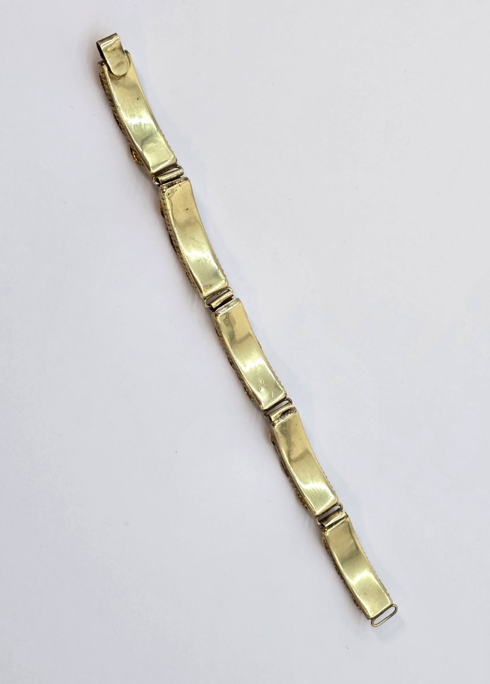 An antique gilt metal link bracelet featuring micro mosaic glass panels, including a central oval panel displaying the word Venezia in white lettering against a blue ground. View X