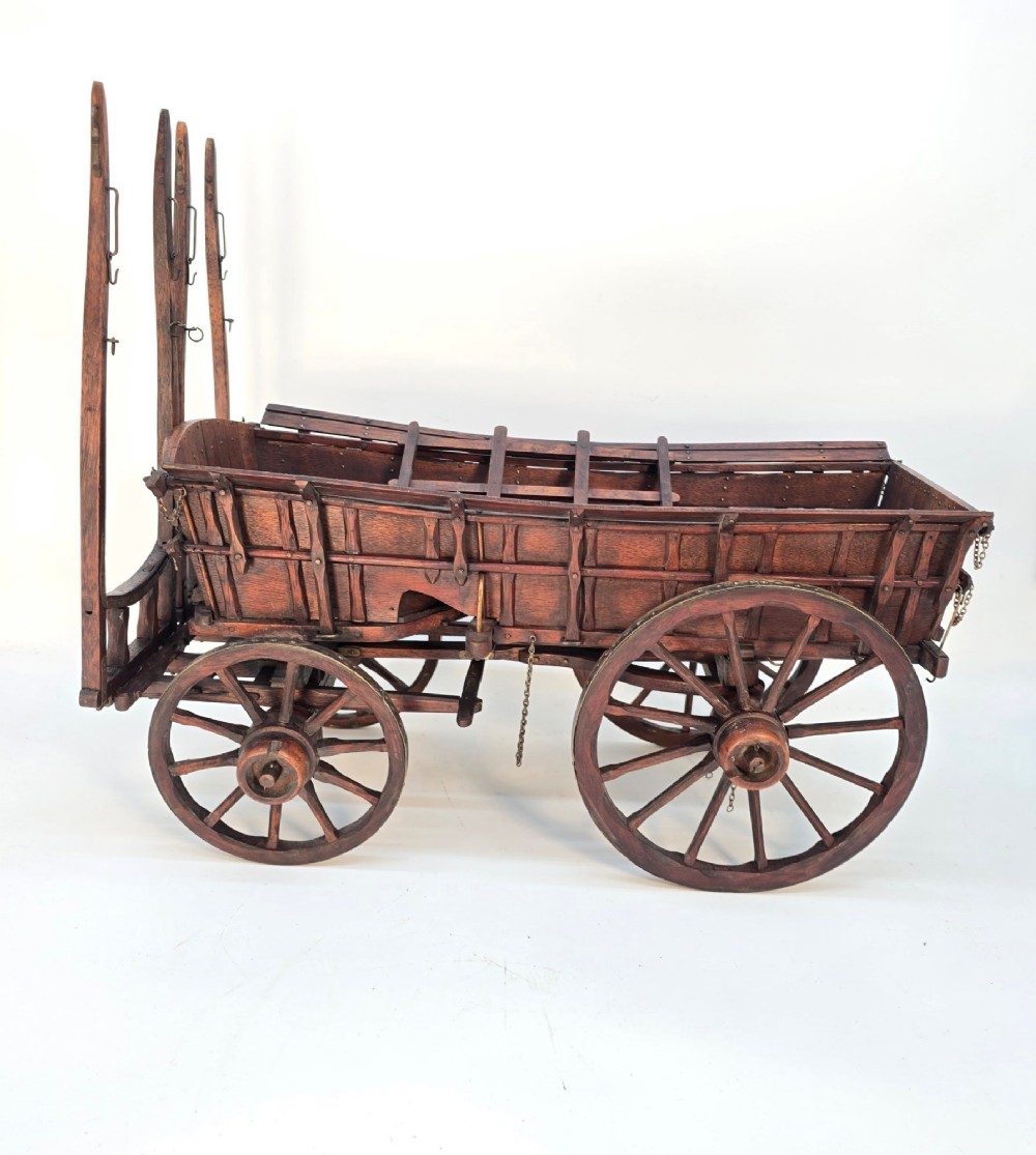 A detailed dark wood scale model of an English twin horse-drawn farm hay cart featuring spoked wheels, iron hardware, and wooden shafts. View III