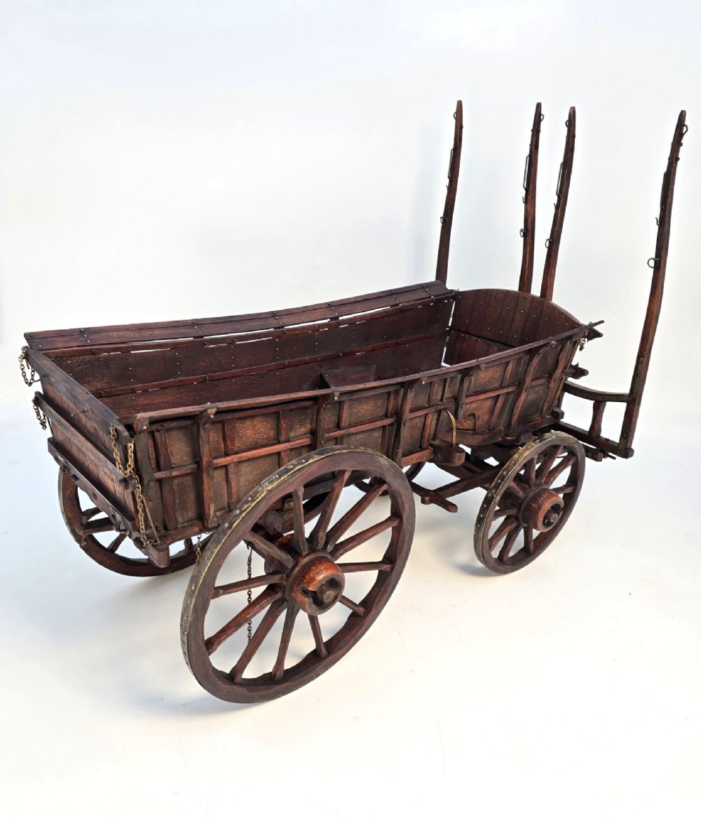 A detailed dark wood scale model of an English twin horse-drawn farm hay cart featuring spoked wheels, iron hardware, and wooden shafts. View VI