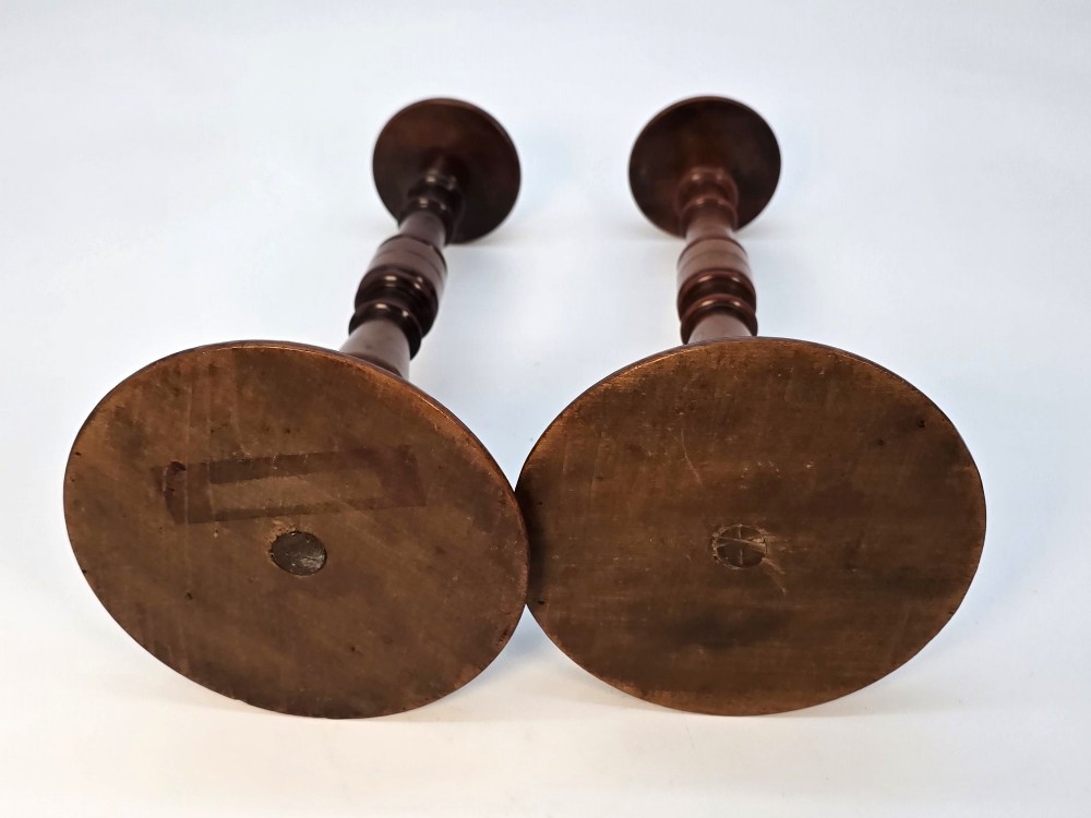 A pair of turned early eighteenth-century yew wood wig stands featuring domed tops, knopped baluster shafts, and turned circular bases. View XV