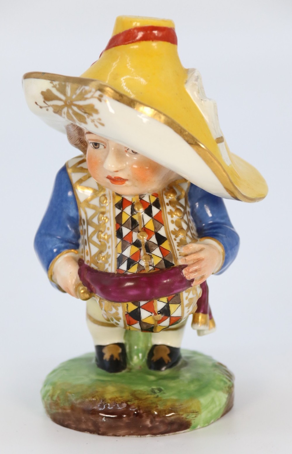 A pair of 19th-century polychrome Samson porcelain figures depicting dwarves wearing oversized brimmed hats and patterned waistcoats on mound bases. View XI
