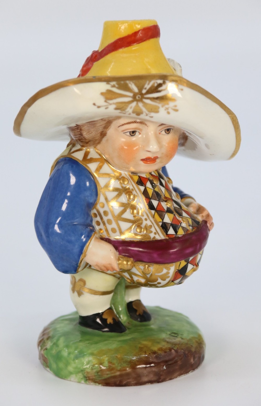 A pair of 19th-century polychrome Samson porcelain figures depicting dwarves wearing oversized brimmed hats and patterned waistcoats on mound bases. View XII