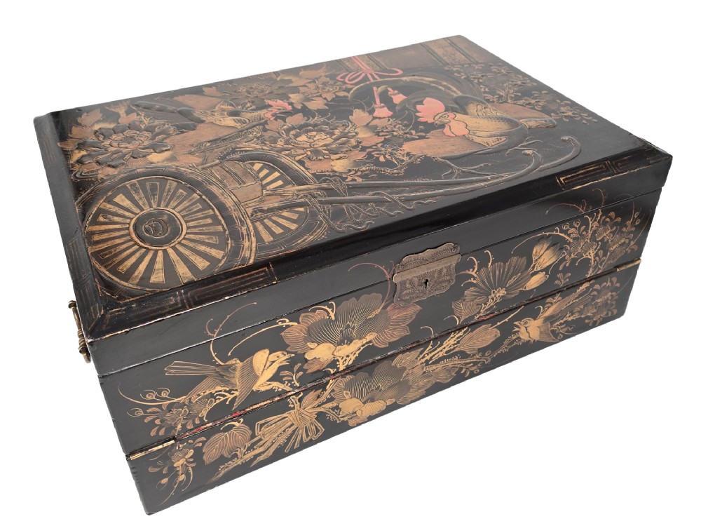 An open black lacquer writing box decorated with gold floral and bird motifs, revealing internal stationery compartments. View XIII