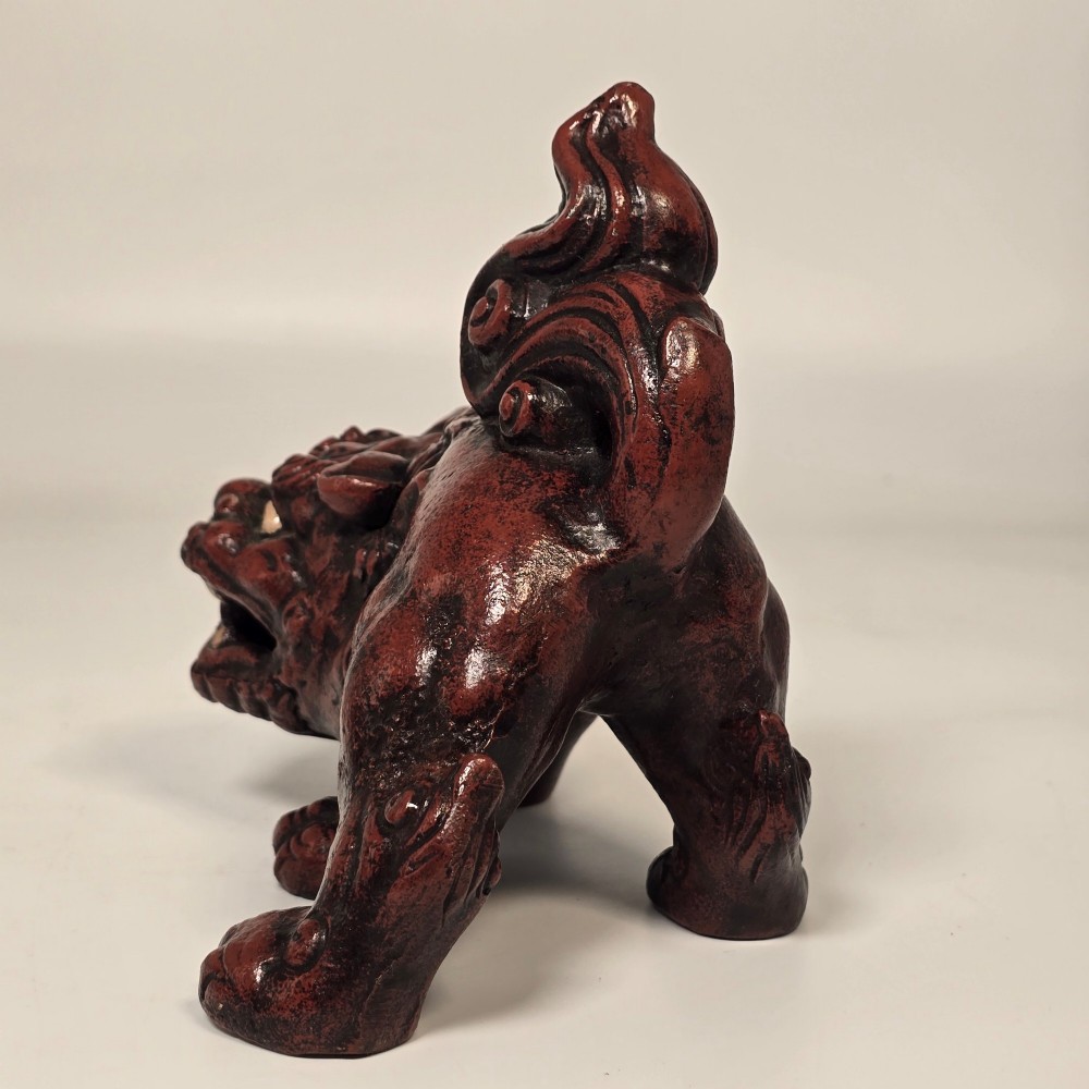 A pair of reddish-brown cast iron Chinoiserie guardian lions with swirling manes and open mouths displaying white painted teeth. View XV