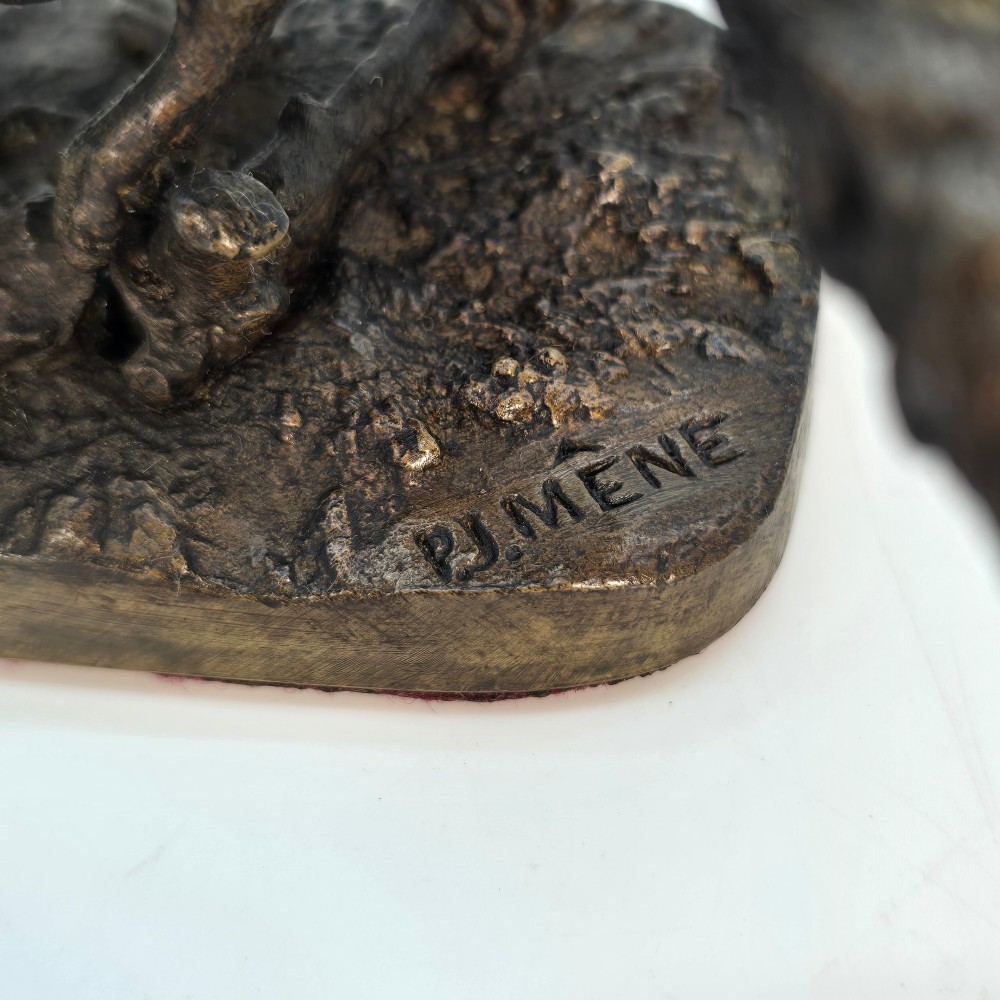 A dark brown patinated bronze sculpture depicting a crouching fox on a naturalistic textured base. View VIII