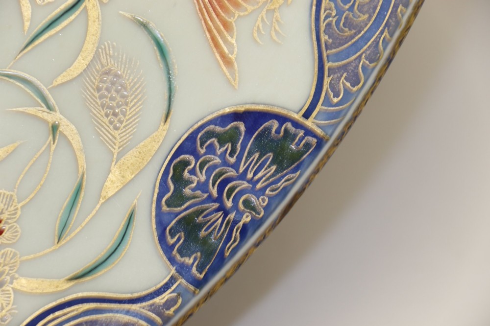 A circular antique Japanese porcelain charger plate with hand-painted cobalt blue, iron red, and gilded decoration featuring birds, goldfish, and floral patterns. View VII
