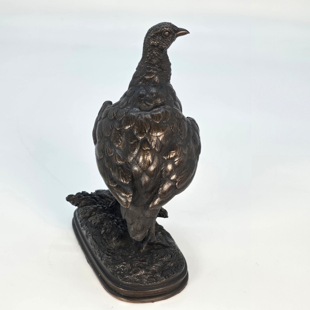 A nineteenth-century dark patinated bronze sculpture of a partridge standing on an integral naturalistic base. View VI